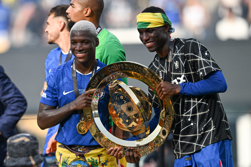 Nicolas Jackson #15 and Moises Caicedo #25 of Chelsea FC celebrate with the FIFA Club World Cup trophy