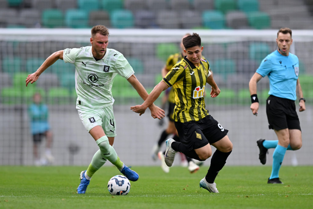 Dastan Satpaev battles for the ball during Olimpija v Kairat Almaty - UEFA Champions League 2025/26 First Qualifying Round First Leg