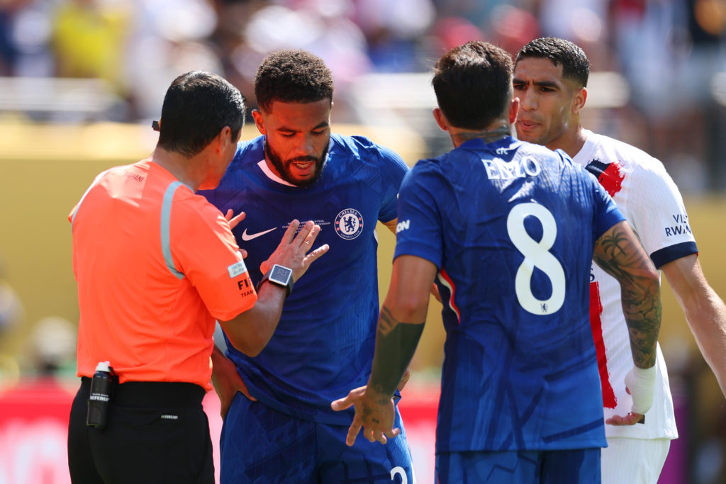 The referee talks to Reece James during Chelsea FC v Paris Saint-Germain: Final - FIFA Club World Cup 2025