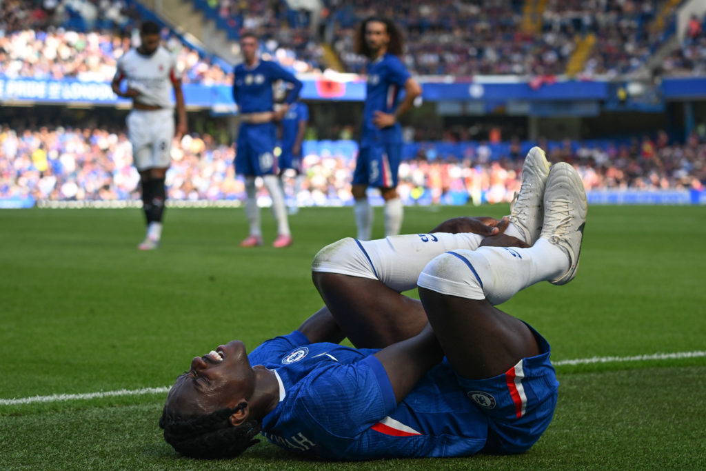 Trevoh Chalobah tends to an injury during Chelsea v Milan - Friendlies