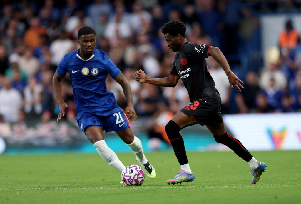Jorrel Hato defending for Chelsea against Bayer Leverkusen's Nathan Tella in a pre-season friendly.
