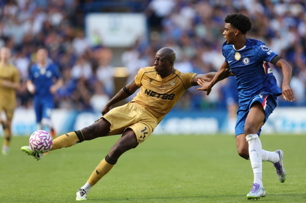 Jean-Philippe Mateta shoots past Josh Acheampong during the Premier League match between Chelsea and Crystal Palace