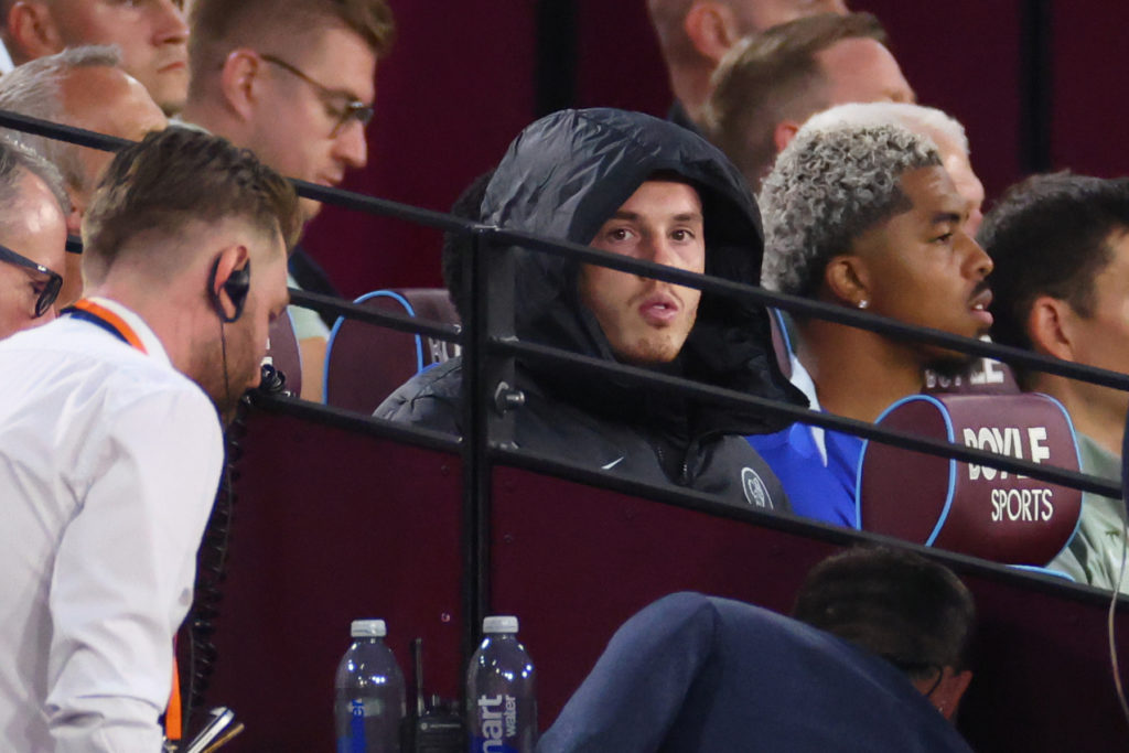 Cole Palmer of Chelsea looks on from the substitutes' bench