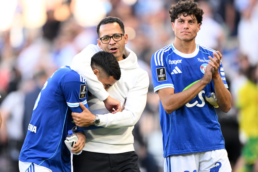 Liam Rosenior embraces Kendry Paez after Strasbourg beat Nantes in Ligue 1.