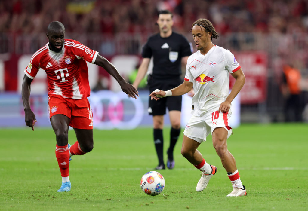 RB Leipzig's Xavi Simons and Bayern Munich's Dayot Upamecano during the Bundesliga fixture.