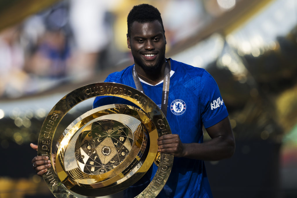 Benoit Badiashile of Chelsea FC poses with the trophy during