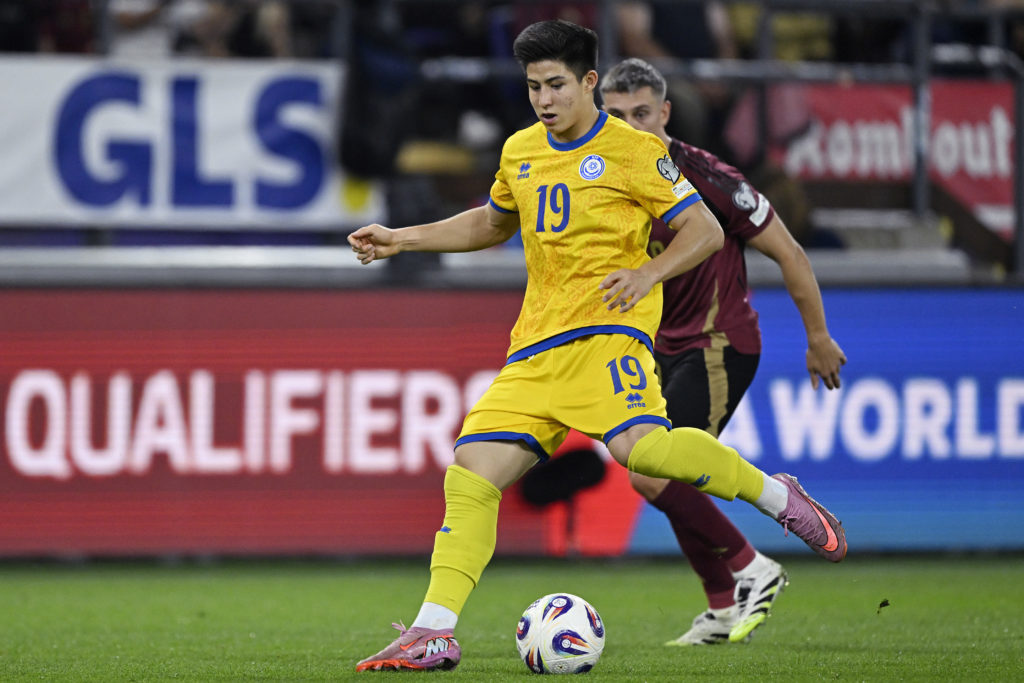 Dastan Satpaev passes the ball during Belgium v Kazakhstan -World Cup Qualifier