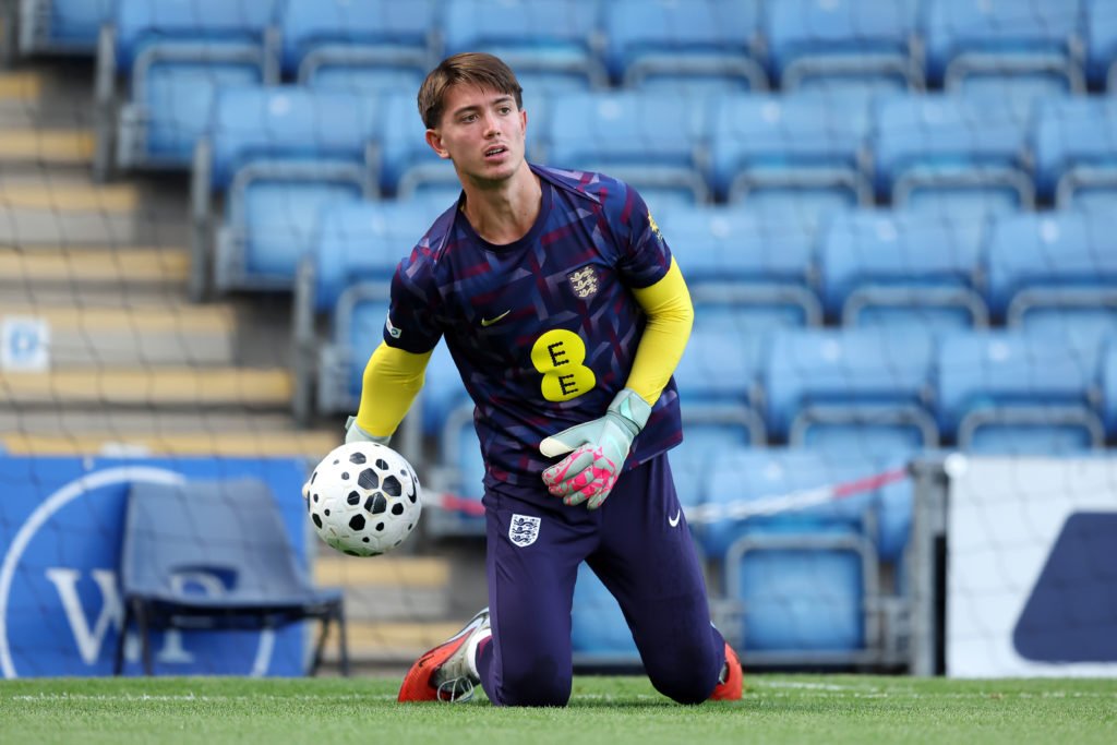 Ted Curd warms up before England against Italy in an U20s international match.