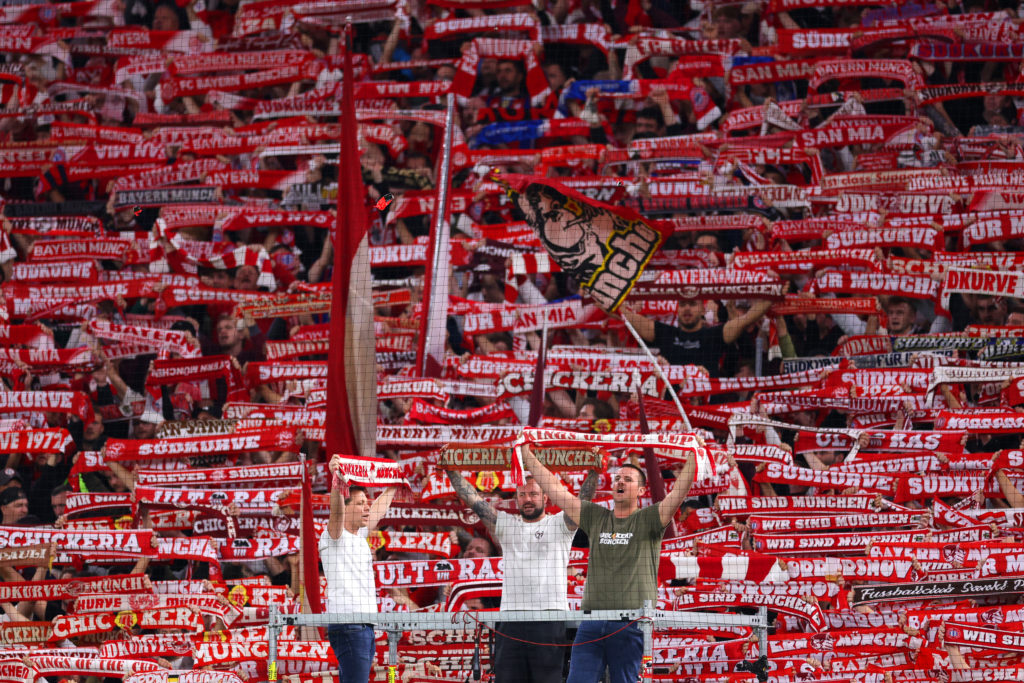 Bayern Munich fans hold up their scarves before the Champions League match against Chelsea.