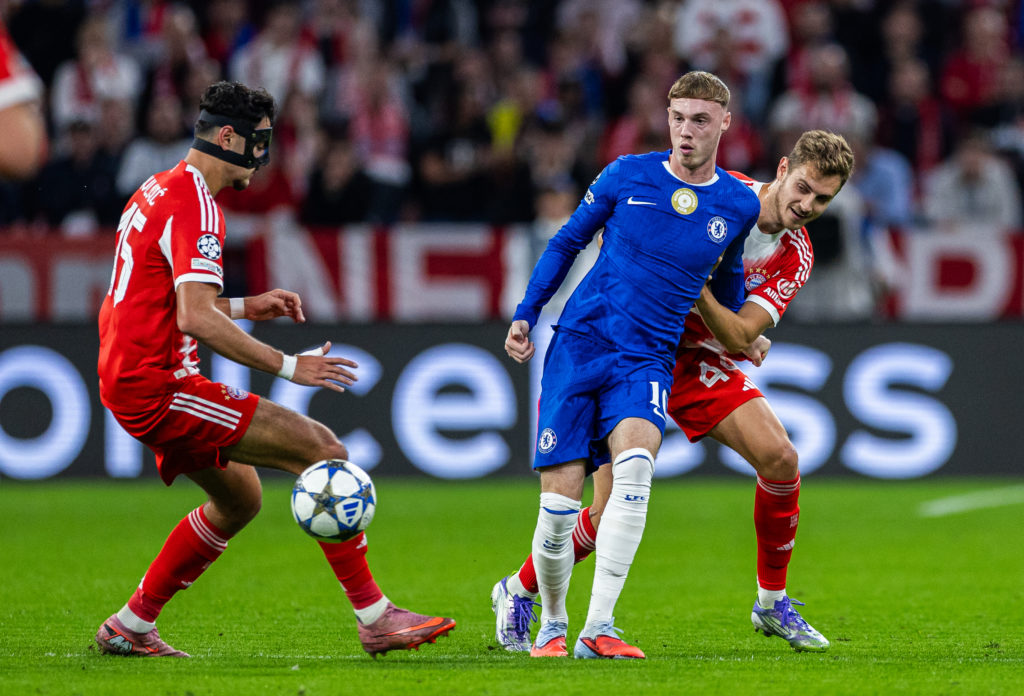 Cole Palmer challenged during Bayern Munich against Chelsea in the Champions League.