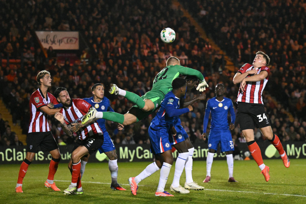 Chelsea goalkeeper Filip Jorgensen comes to punch ball