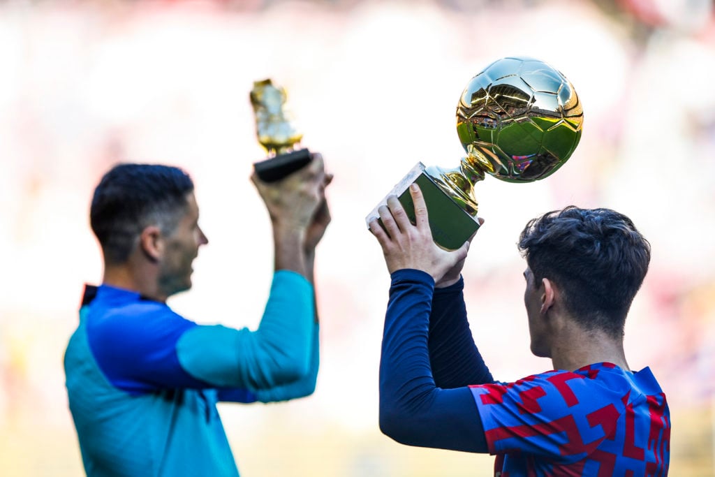 Gavi of FC Barcelona showing the Golden Boy trophy