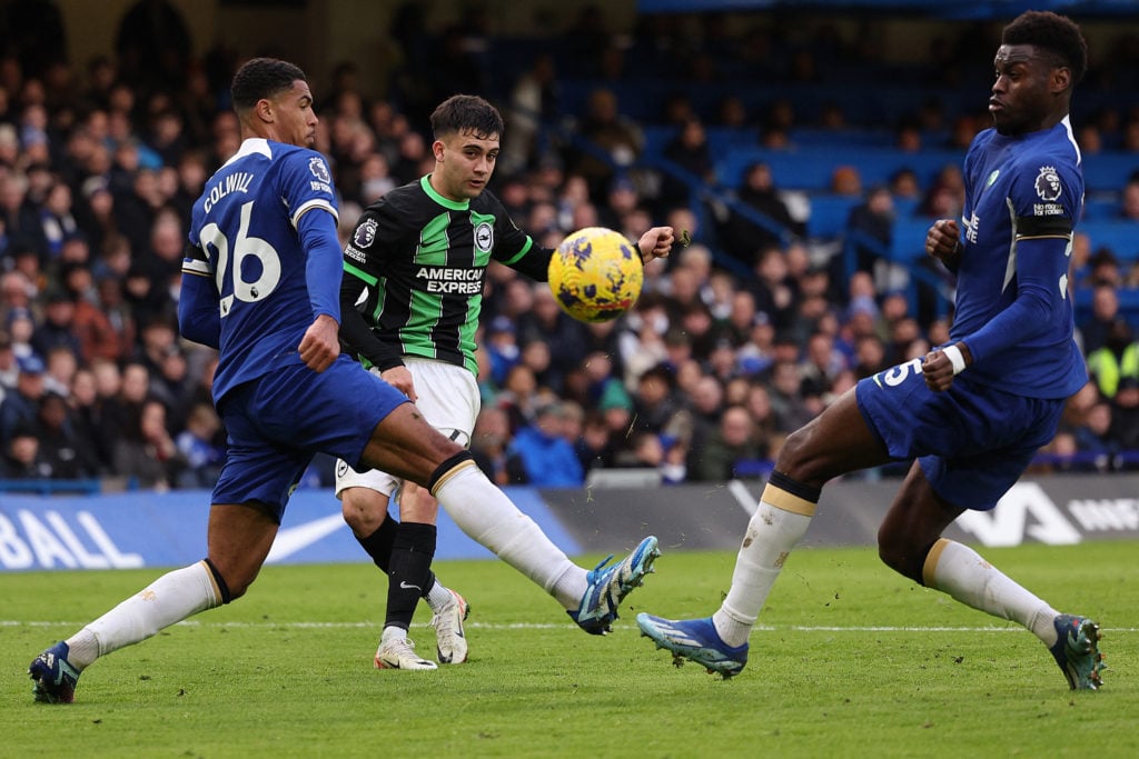 Brighton's Argentinian midfielder #40 Facundo Buonanotte (C) kicks the ball to score a goal past Chelsea's English defender #26 Levi Colwill and Chelsea's French defender #05 Benoit Badiashile during the English Premier League football match between Chelsea and Brighton