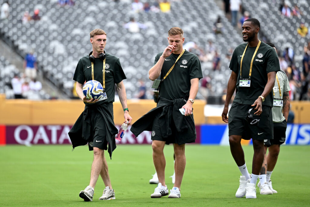 Cole Palmer, Liam Delap and Tosin Adarabioyo inspect the pitch before Chelsea against Paris Saint-Germain in the Club World Cup final.