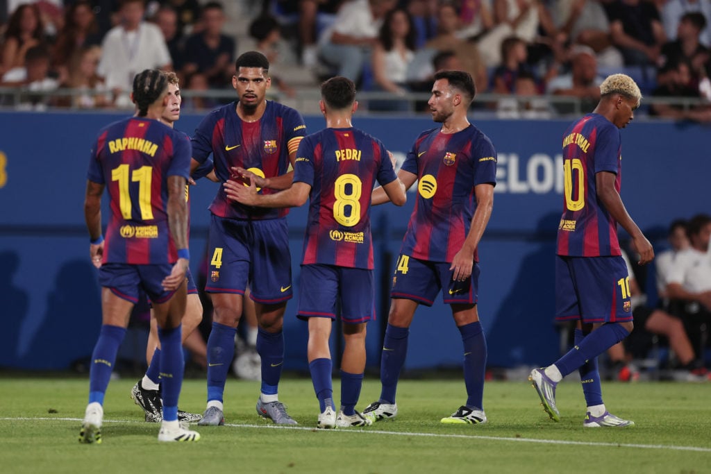 Barcelona players celebrate after scoring goal