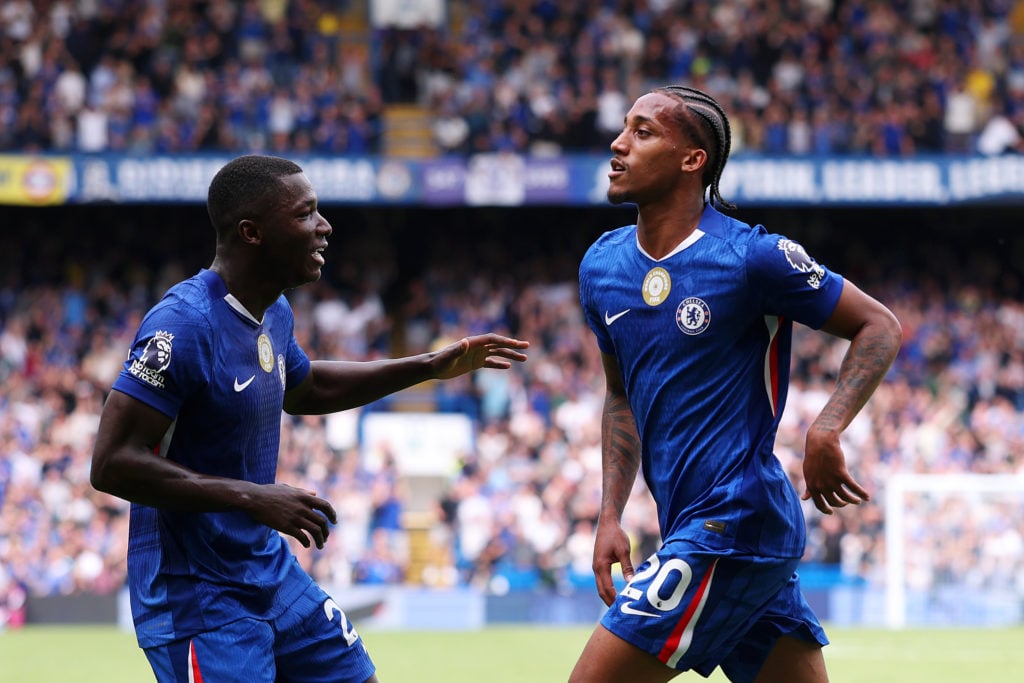 Joao Pedro of Chelsea celebrates scoring his team's first goal with teammate Moises Caicedo during the Premier League match between Chelsea and Fulham