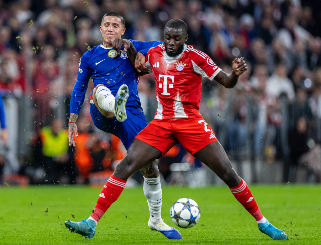 Chelsea midfielder Enzo Fernandez and Bayern Munich defender Dayot Upamecano battling for the ball