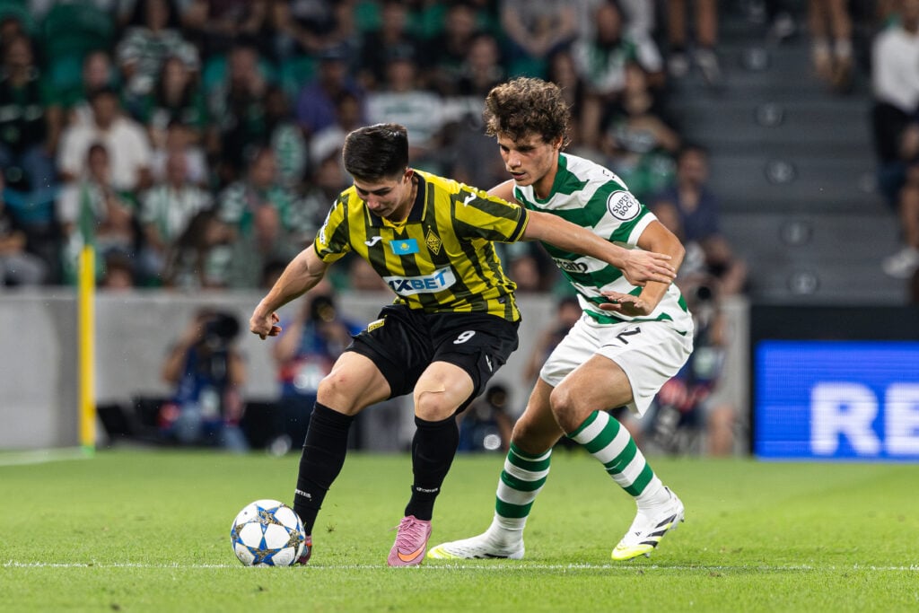 Dastan Satpaev of FC Kairat Almaty with Eduardo Quaresma of Sporting CP.