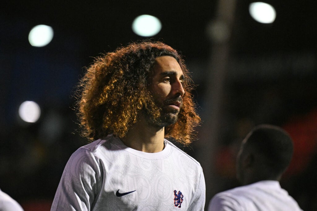 Marc Cucurella warms up before Chelsea's game against Lincoln City in the Carabao Cup.
