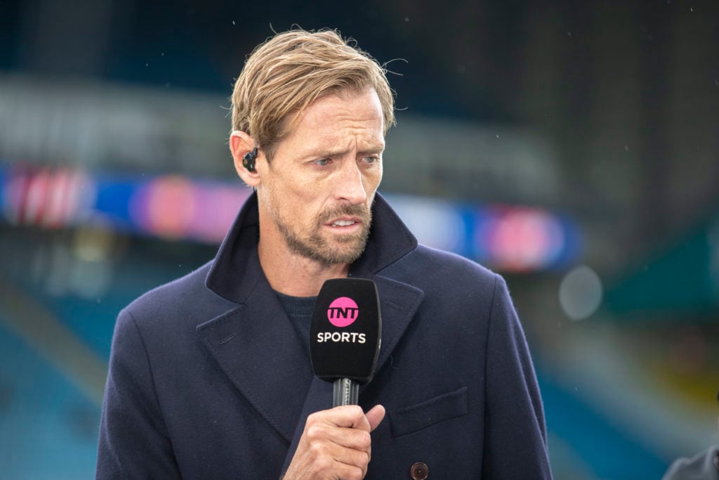 Peter Crouch working as a pundit for TNT Sports in a Premier League match.