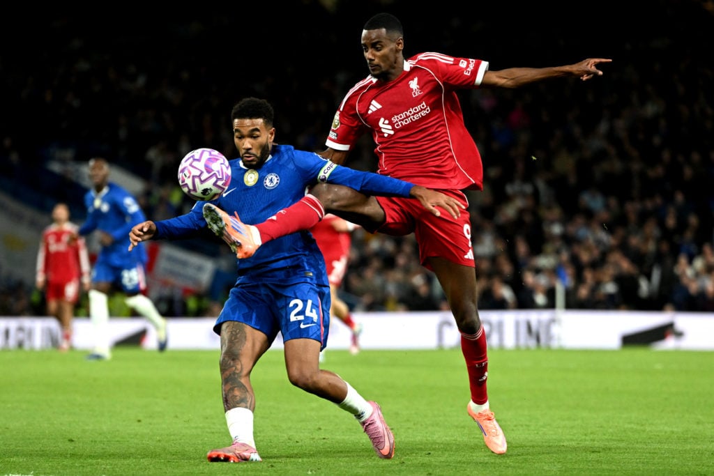 Chelsea's Reece James battles Liverpool's Alexander Isak for possession during a Premier League match.