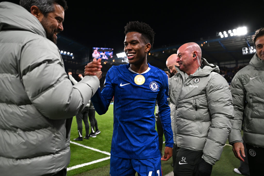 Chelsea staff congratulating Estevao Willian