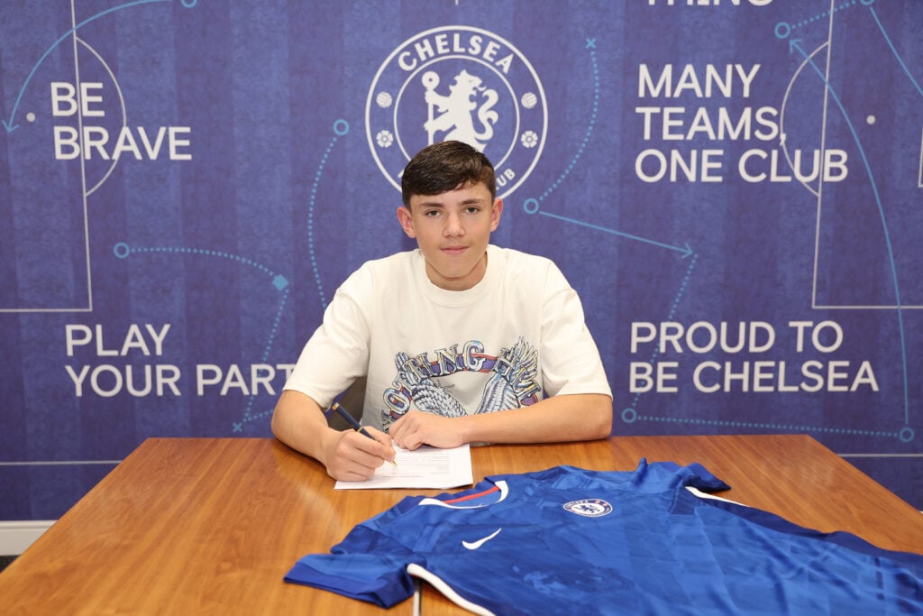 Reggie Walsh poses after signing his first professional contract with Chelsea.