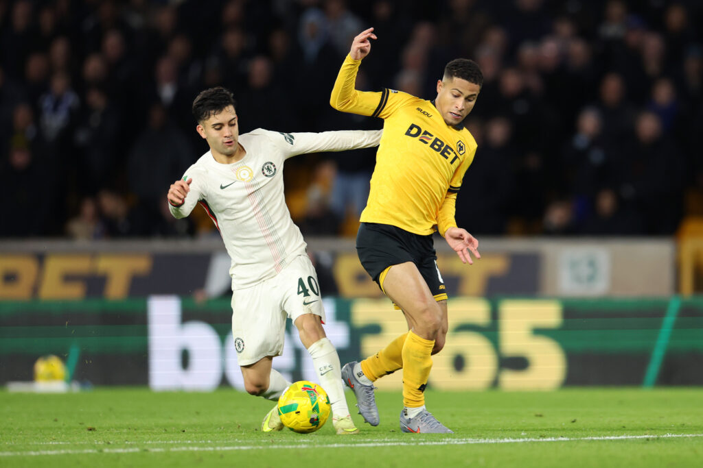 Facundo Buonanotte of Chelsea battles for possession with Joao Gomes of Wolverhampton Wanderers