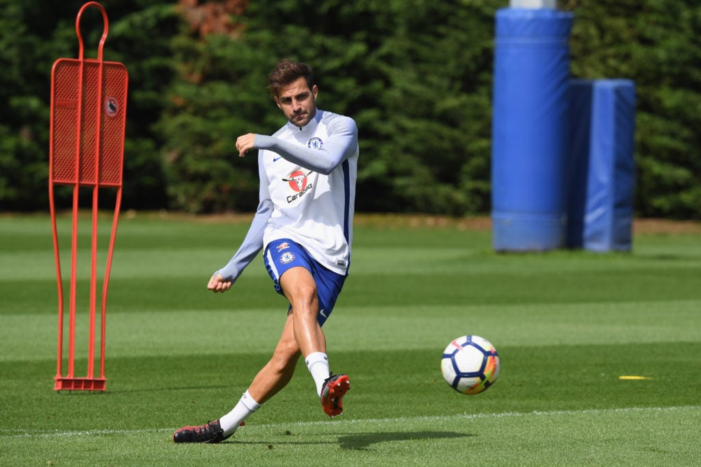 Cesc Fabregas kicks the ball during a Chelsea training session.