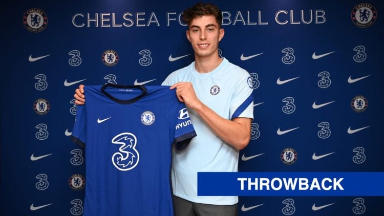 Kai Havertz holds up a shirt after officially signing for Chelsea.