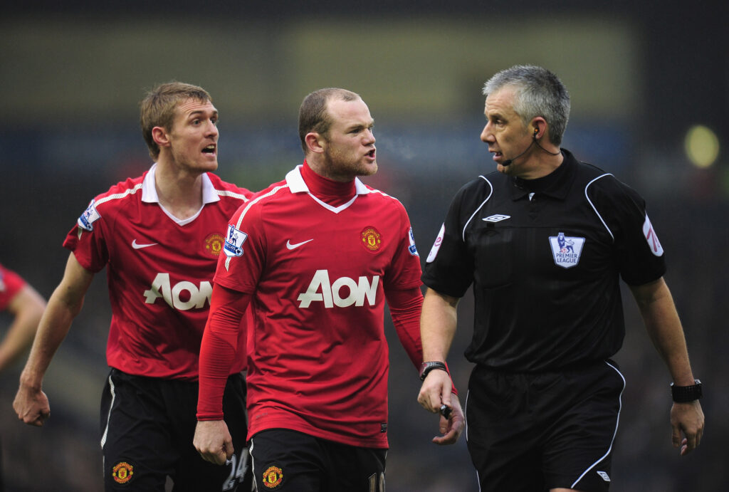 Manchester United forward Wayne Rooney complaining to referee