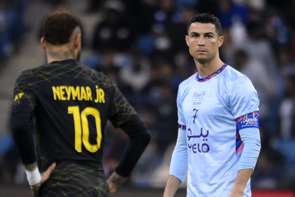 PSG forward Neymar and Riyadh All-Star's Cristiano Ronaldo standing