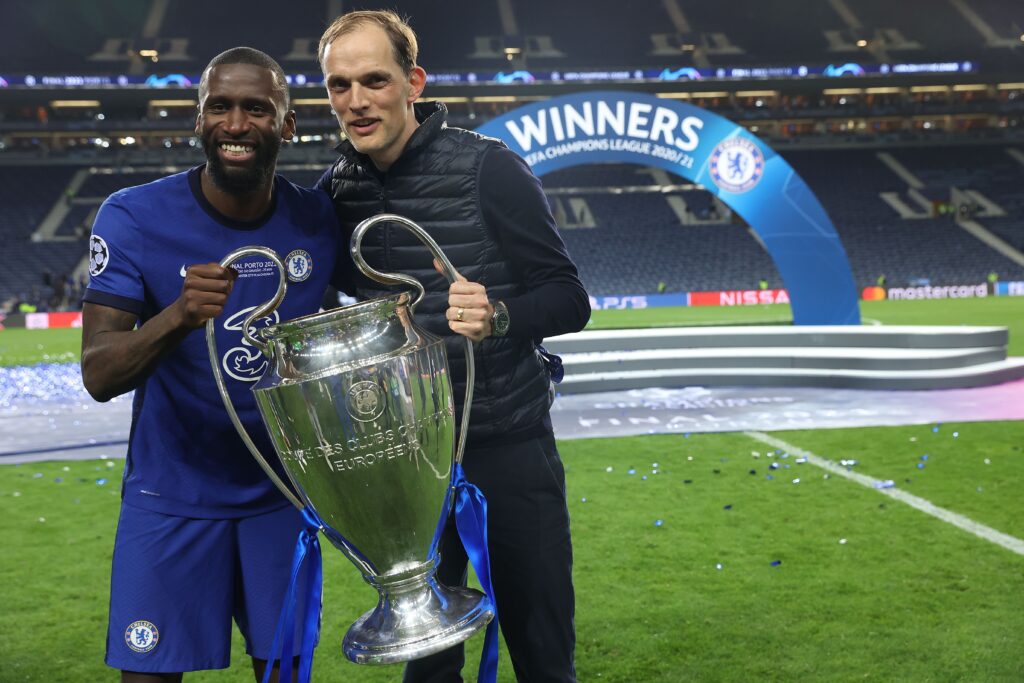 Antonio Rudiger and Thomas Tuchel holding Champions League trophy