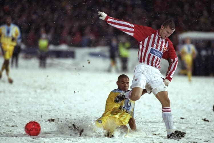 23 Oct 1997:  Andy Myers of Chelsea (left) makes a slide tackle during the European Cup Winners Cup first leg match against Tromso at Tromso in Nor...