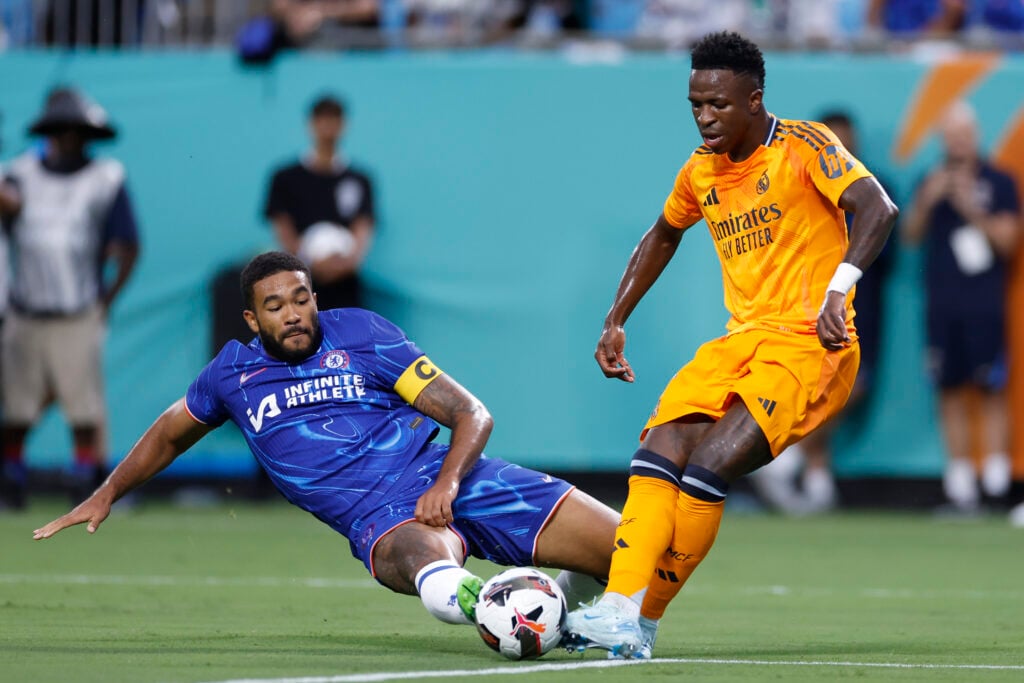 Chelsea defender Reece James tries to tackle Real Madrid forward Vinicius Junior