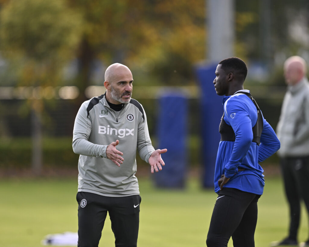Enzo Maresca giving instructions to Moises Caicedo during Chelsea training session