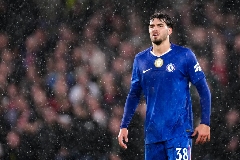 Chelsea striker Marc Guiu standing in the rain