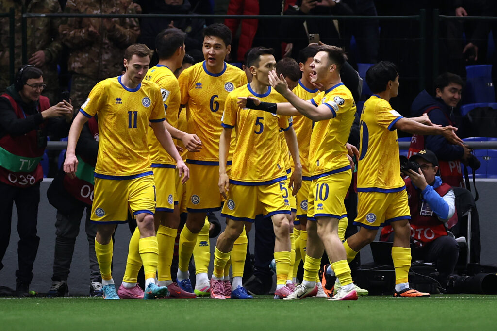 Players celebrate with Dastan Satpaev during Kazakhstan v Belgium - FIFA World Cup 2026 Qualifier
