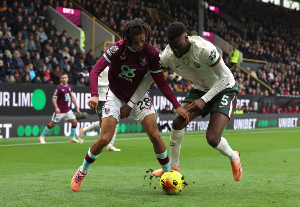 Hannibal Mejbri and Benoit Badiashile battle for the ball during Burnley v Chelsea - Premier League
