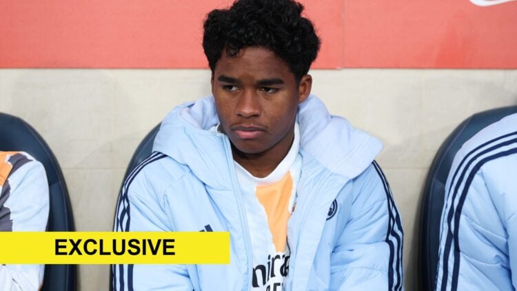 Real Madrid forward Endrick sitting on the bench