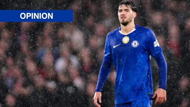 Chelsea striker Marc Guiu standing in the rain