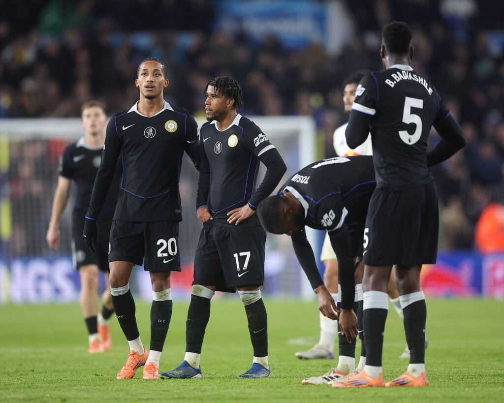 Chelsea players look dejected after Leeds goal