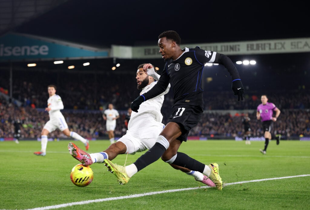 Jamie Gittens of Chelsea is challenged by Jayden Bogle of Leeds United