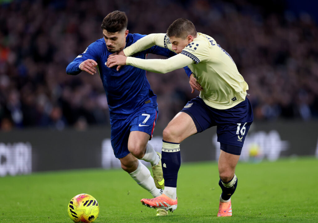 Pedro Neto takes on Vitaliy Mykolenko during Chelsea vs Everton
