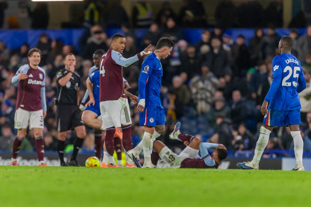Ezri Konsa of Aston Villa reacts to Enzo Fernandez of Chelsea