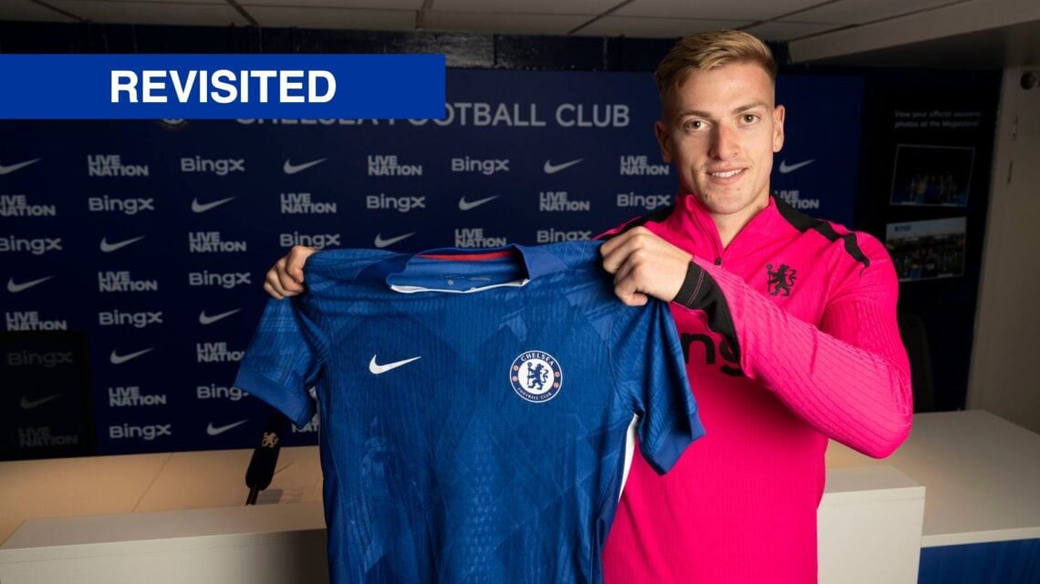 Liam Delap holds up a shirt after being unveiled by Chelsea as their new summer signing.