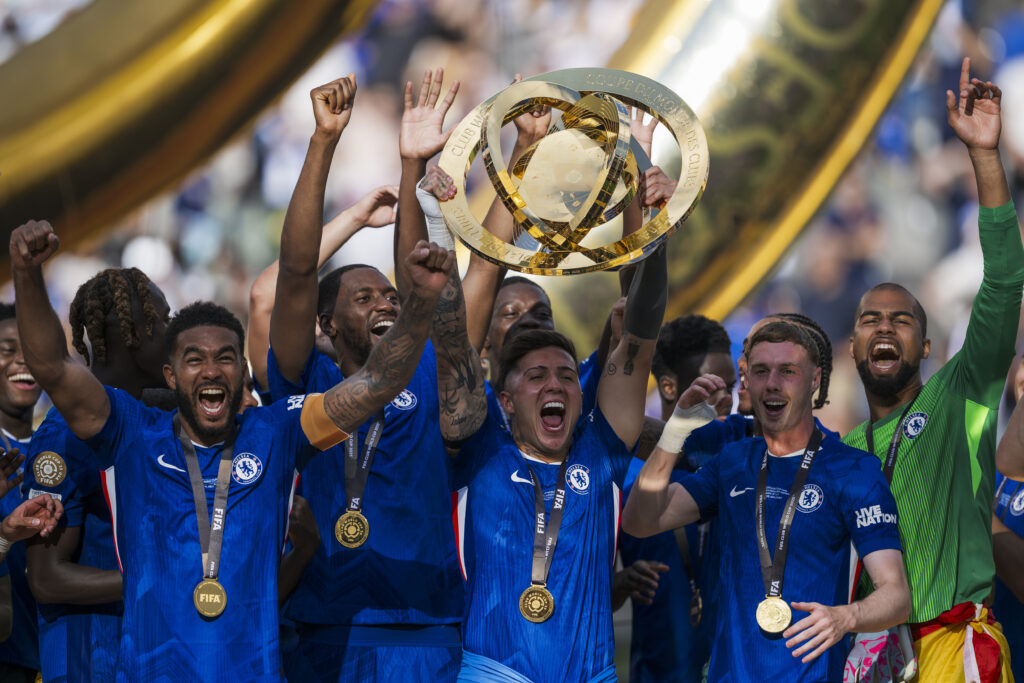 Enzo Fernandez (C) of Chelsea FC lifts the trophy as his