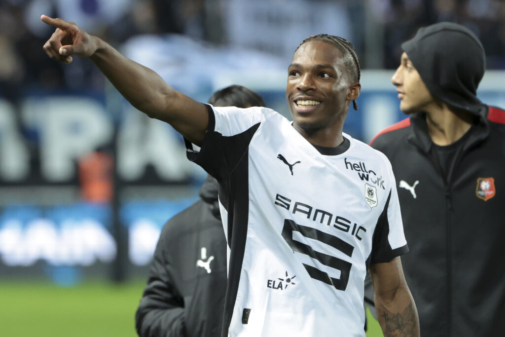 Jeremy Jacquet of Rennes and teammates celebrate the victory