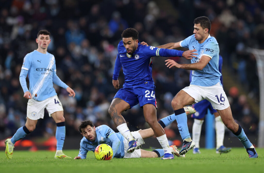 Reece James of Chelsea is challenged by Rodri of Manchester City