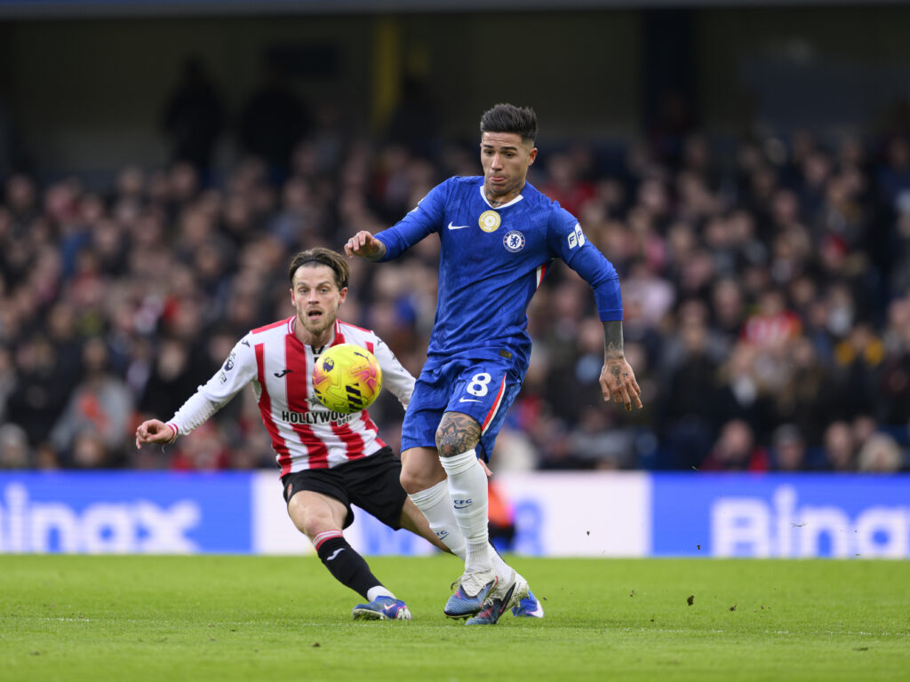 Chelsea's Enzo Fernandez (right) holds off the challenge from Brentford's Mathias Jensen